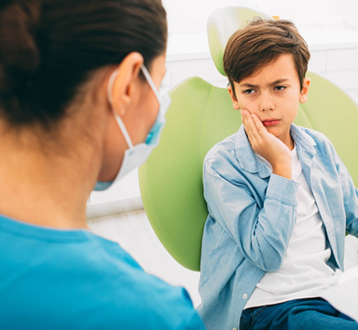 Young boy at dentist preparing for pulp treatment in Grayslake